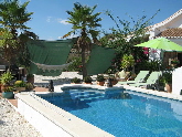 Swimming pool with barbeque on the left